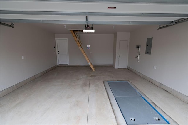 garage featuring a garage door opener and electric panel