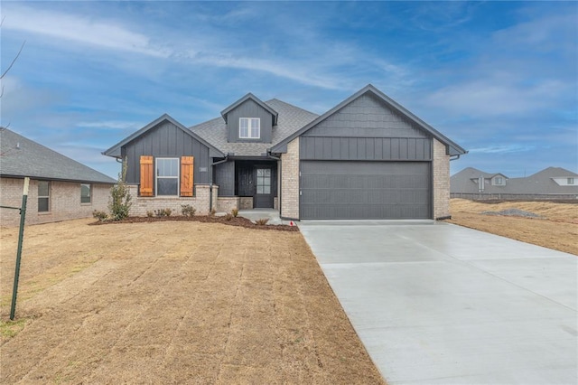 view of front of home with a garage and a front yard