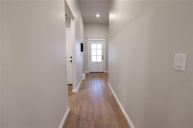 doorway to outside featuring light hardwood / wood-style floors