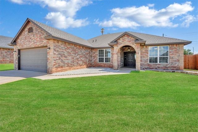 single story home with a front yard and a garage