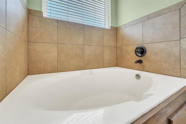 bathroom with a washtub