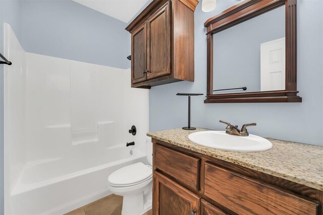 full bathroom featuring tile patterned floors, vanity, toilet, and bathing tub / shower combination