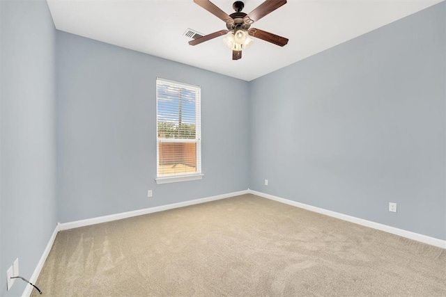 unfurnished room with ceiling fan and light colored carpet