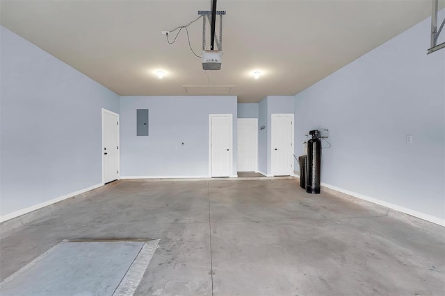 garage featuring electric panel and a garage door opener