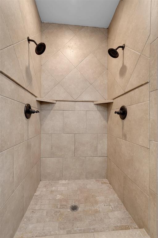 bathroom with a tile shower