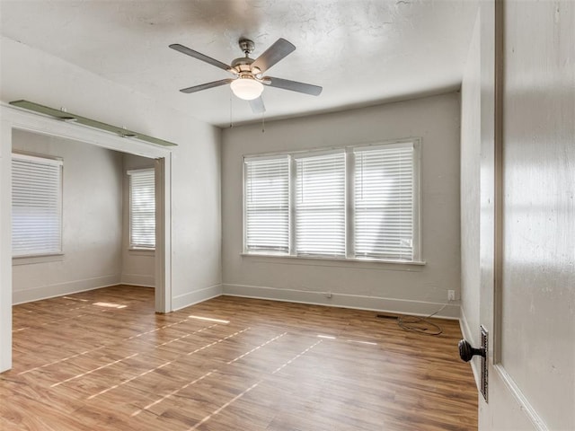 unfurnished room featuring hardwood / wood-style flooring and ceiling fan