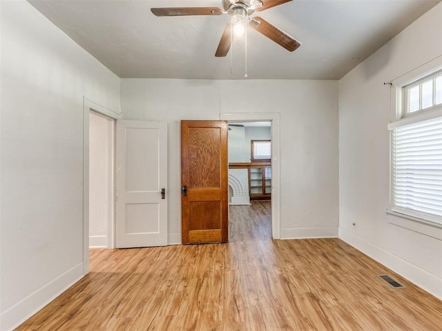 unfurnished room with ceiling fan and light hardwood / wood-style floors