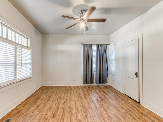 unfurnished room featuring ceiling fan and light hardwood / wood-style flooring