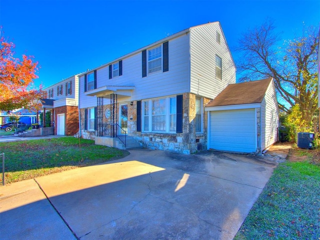 view of front of property featuring central AC and a front lawn