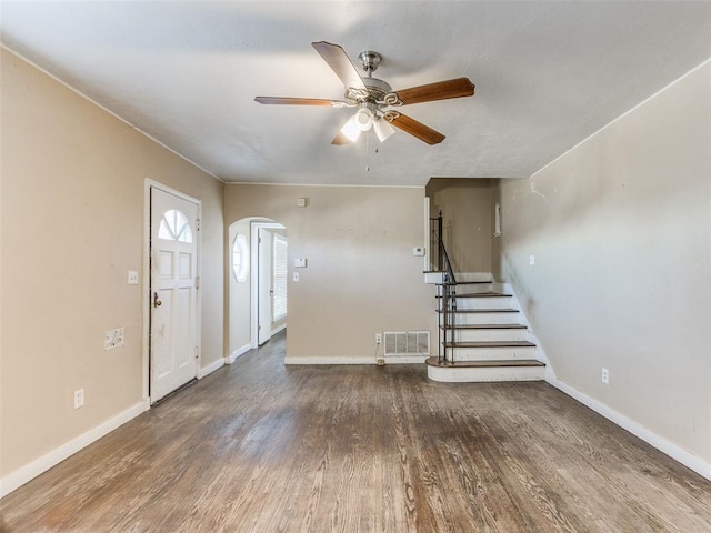 foyer featuring ceiling fan and dark wood-type flooring