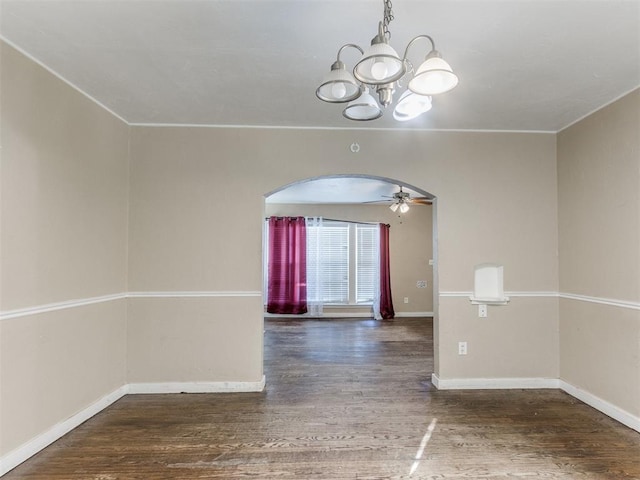 unfurnished room with ceiling fan with notable chandelier and dark hardwood / wood-style floors