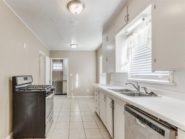 kitchen featuring white cabinets, light tile patterned flooring, sink, and stainless steel appliances