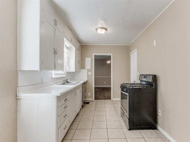 kitchen featuring white cabinets, black gas stove, sink, stainless steel dishwasher, and light tile patterned floors