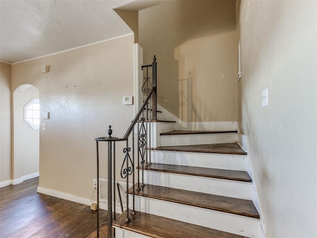 stairway featuring hardwood / wood-style flooring