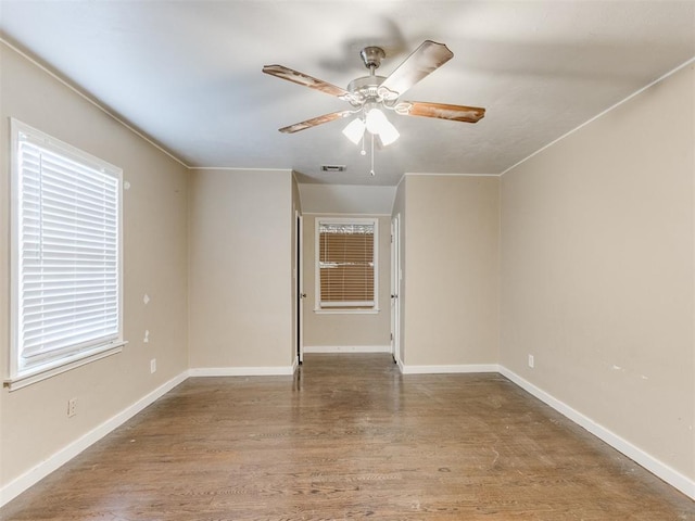 empty room featuring ceiling fan and hardwood / wood-style flooring