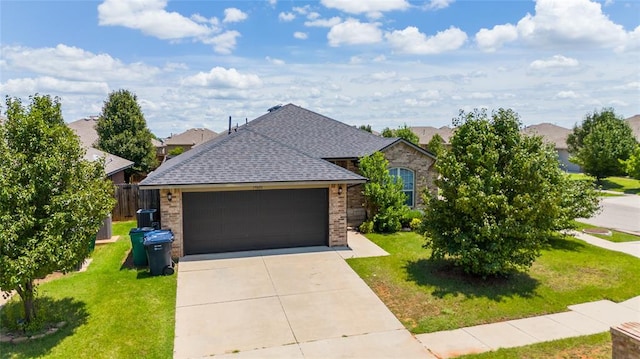 view of front of house with a garage and a front lawn