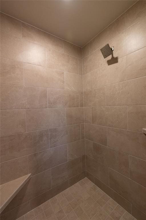 bathroom with tiled shower