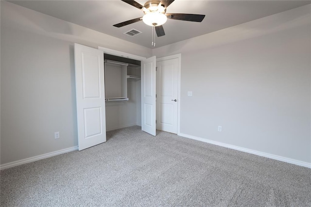 unfurnished bedroom featuring ceiling fan, carpet flooring, and a closet