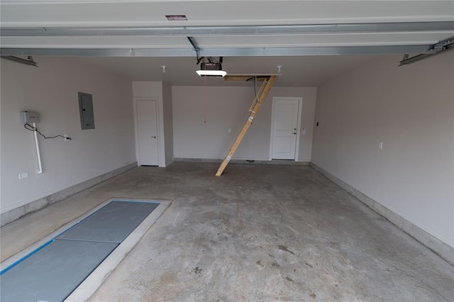 garage featuring a garage door opener and electric panel