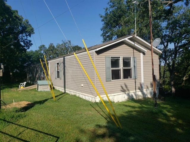 view of property exterior featuring a yard