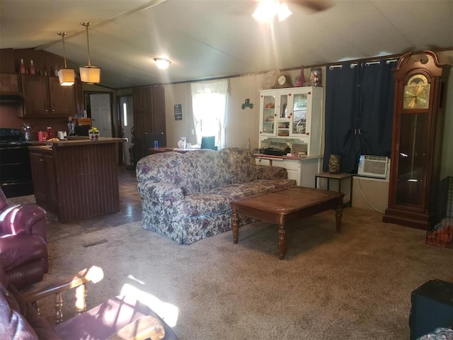 living room with carpet floors, vaulted ceiling, ceiling fan, and cooling unit