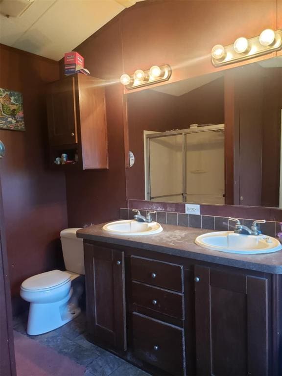 bathroom featuring tasteful backsplash, walk in shower, vanity, tile patterned flooring, and lofted ceiling