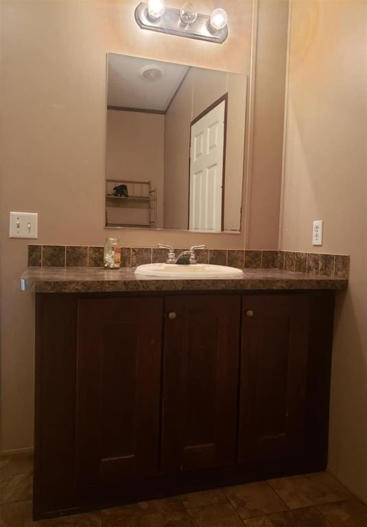 bathroom featuring tile patterned floors and vanity