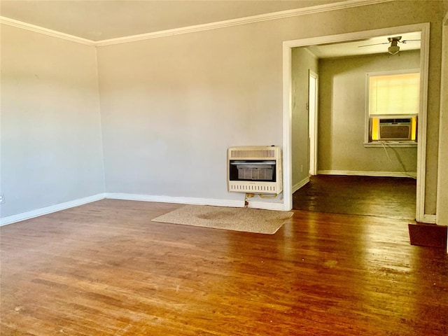 interior space featuring cooling unit, heating unit, hardwood / wood-style flooring, and crown molding