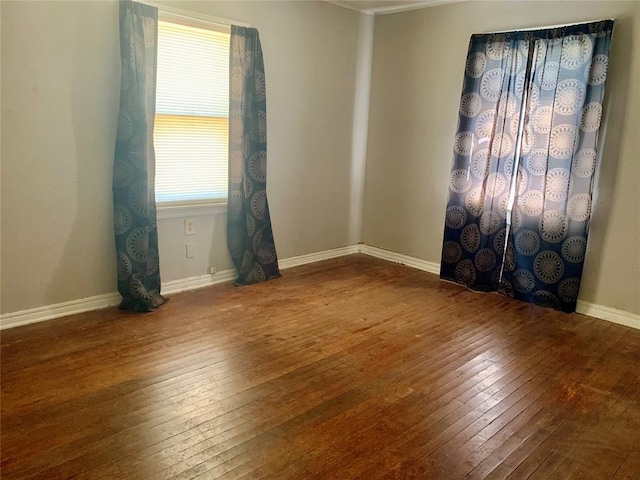 unfurnished room with hardwood / wood-style flooring