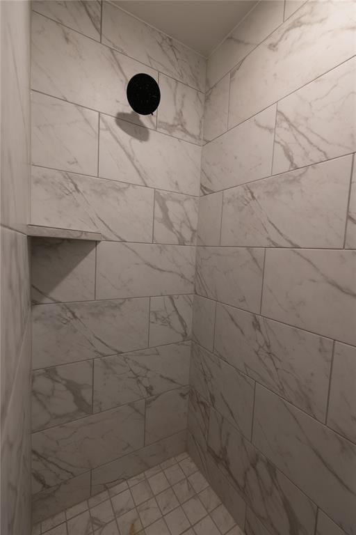 bathroom featuring tiled shower