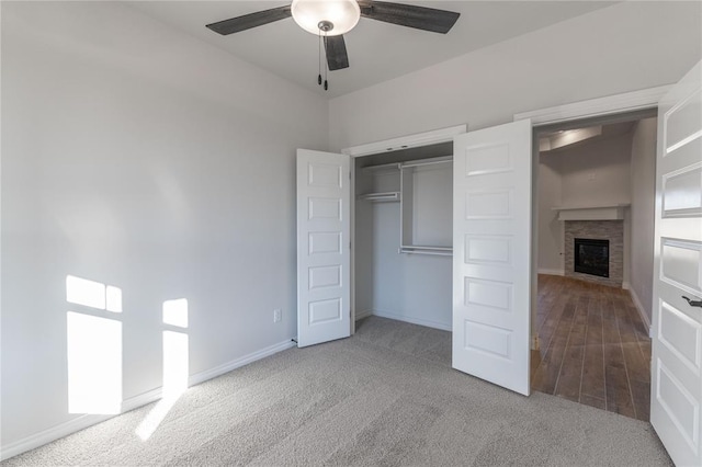 unfurnished bedroom featuring light carpet, a closet, and ceiling fan