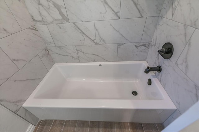 bathroom featuring a tub to relax in