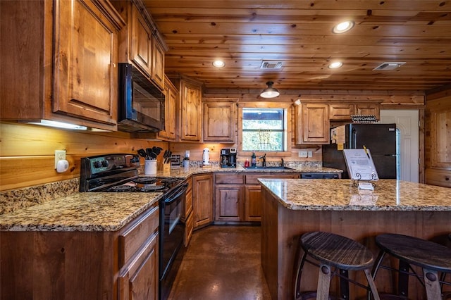 kitchen with sink, a center island, wooden ceiling, light stone counters, and black appliances