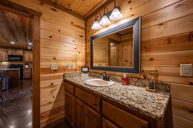 bathroom with vanity, wooden walls, and wood ceiling