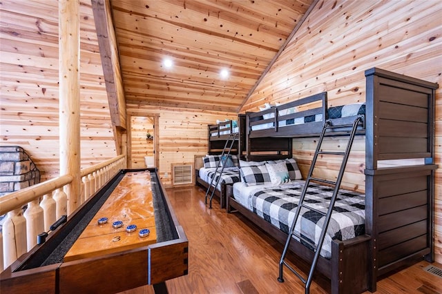 bedroom with hardwood / wood-style flooring, wood walls, wood ceiling, and vaulted ceiling