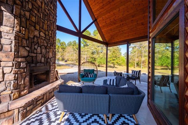 view of patio featuring an outdoor living space with a fireplace