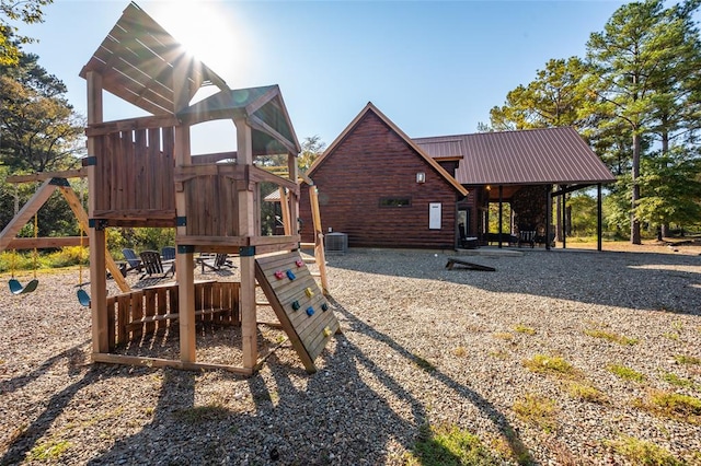 view of jungle gym with central AC unit