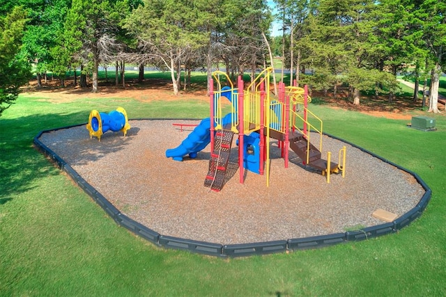 view of playground with a lawn