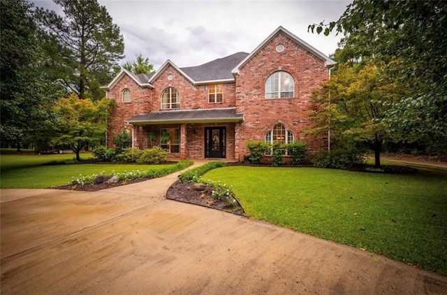 front facade with a front yard