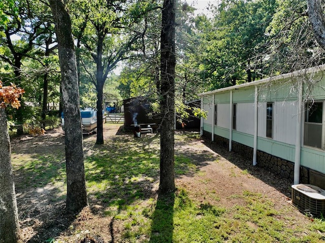 view of yard featuring central AC