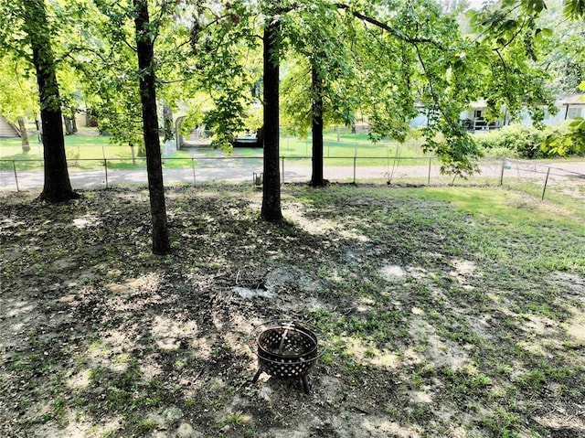 view of yard featuring a fire pit