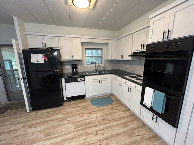 kitchen with black appliances, light hardwood / wood-style floors, white cabinets, and sink