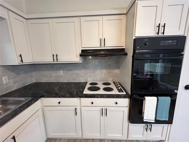 kitchen featuring double oven, decorative backsplash, white gas stovetop, and white cabinets