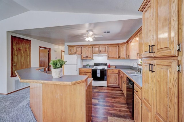 kitchen featuring white appliances, dark wood-type flooring, a kitchen island with sink, sink, and vaulted ceiling