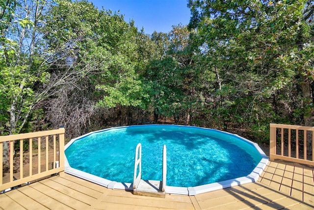 view of pool featuring a wooden deck