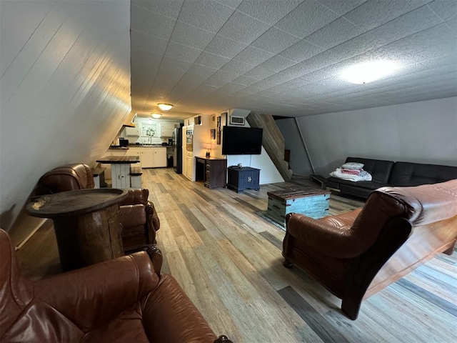 living room with light hardwood / wood-style flooring