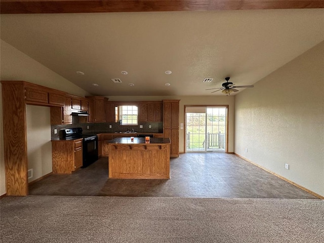 kitchen featuring black / electric stove, decorative backsplash, vaulted ceiling, and dark colored carpet