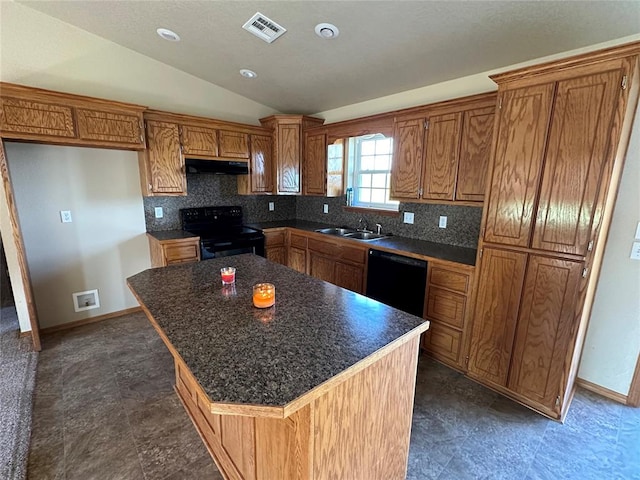 kitchen with a center island, lofted ceiling, backsplash, black appliances, and sink