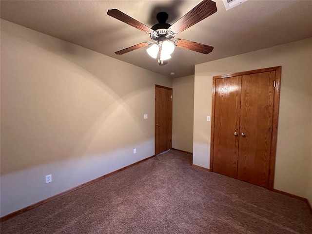 unfurnished bedroom featuring carpet flooring, a closet, and ceiling fan