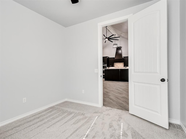 unfurnished bedroom featuring carpet floors and ceiling fan